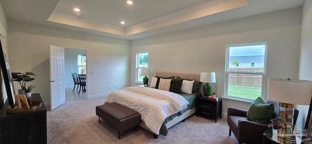 5023 Vanerka Dr, Gulf Breeze, FL 32563 - bedroom featuring light colored carpet, multiple windows, recessed lighting, ornamental molding, and a tray ceiling