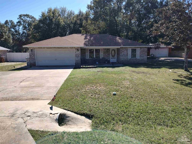 ranch-style home with a front lawn and a garage