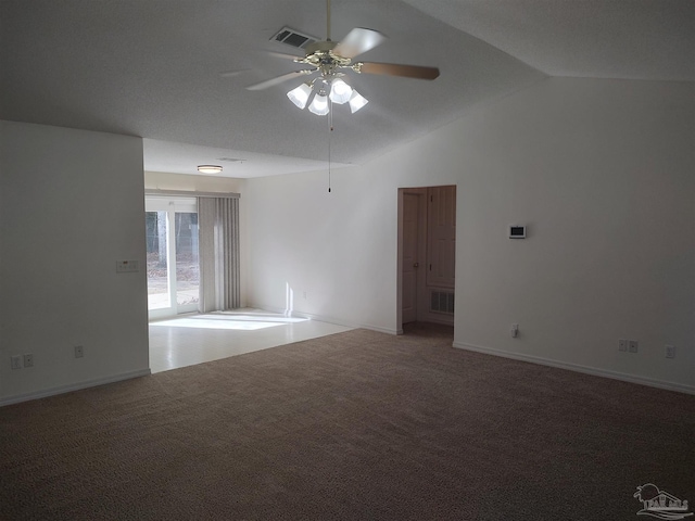 unfurnished room with ceiling fan, lofted ceiling, and carpet floors