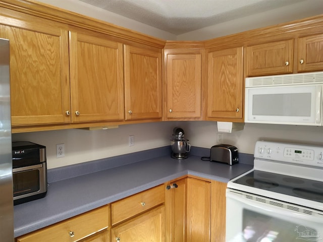 kitchen featuring white appliances