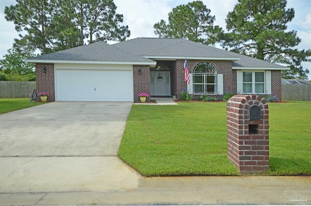 5735 Farrel Way, Milton, FL 32583 - view of front of property featuring driveway, a garage, brick siding, and roof with shingles
