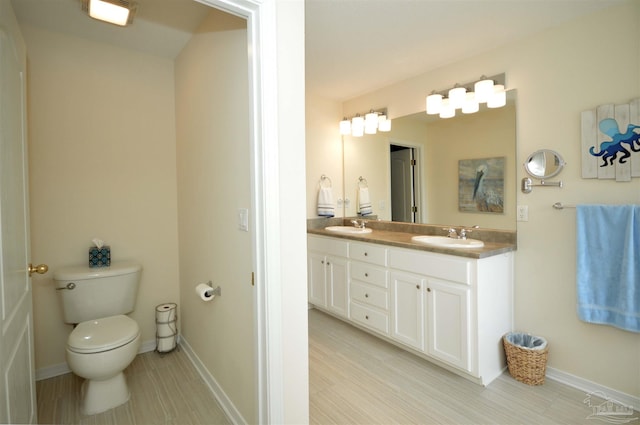 5735 Farrel Way, Milton, FL 32583 - full bath with double vanity, toilet, and baseboards