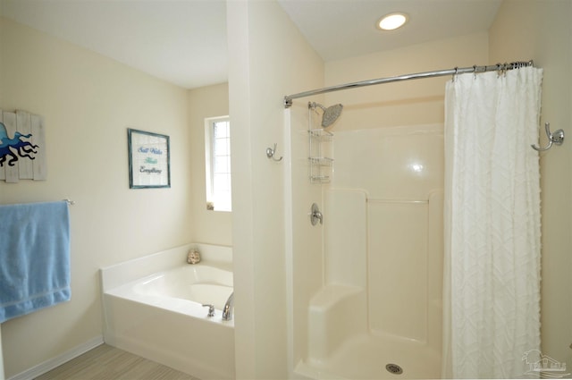 5735 Farrel Way, Milton, FL 32583 - full bath featuring a garden tub, a shower with curtain, and baseboards