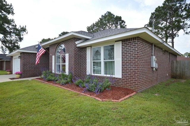 5735 Farrel Way, Milton, FL 32583 - view of home's exterior with brick siding, an attached garage, and a shingled roof