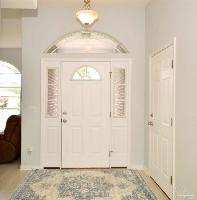 5735 Farrel Way, Milton, FL 32583 - entrance foyer with light wood-style flooring and baseboards