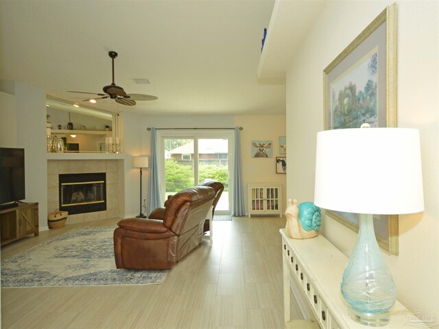 5735 Farrel Way, Milton, FL 32583 - living area with a ceiling fan and a fireplace