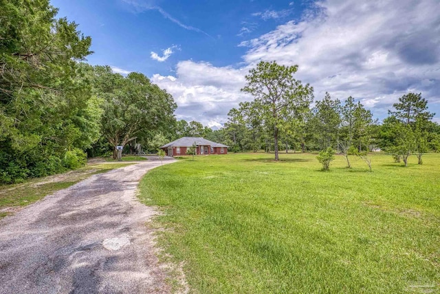 view of front of property with a front lawn and driveway