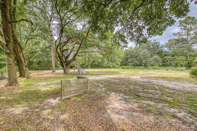 view of yard featuring a wooded view