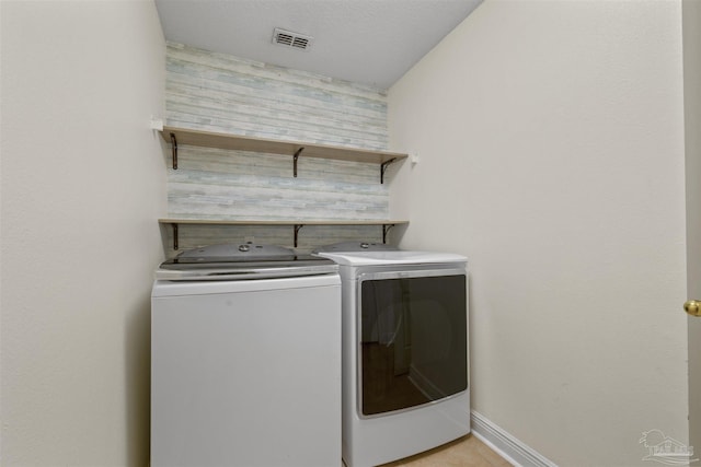 laundry room featuring separate washer and dryer