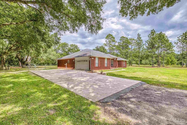 exterior space with a garage, driveway, and brick siding