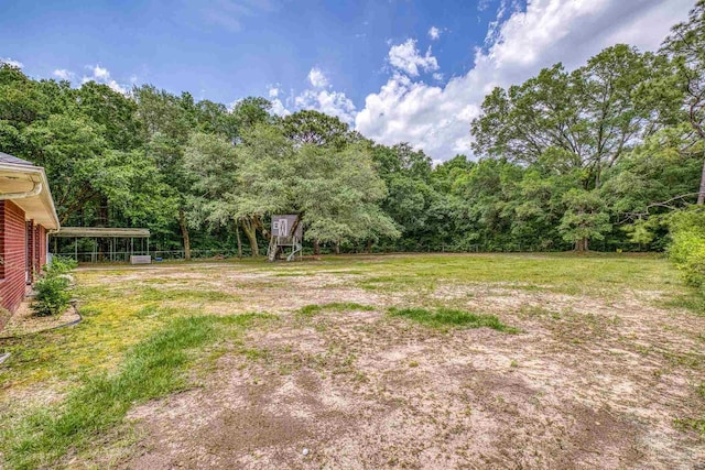 view of yard featuring a wooded view