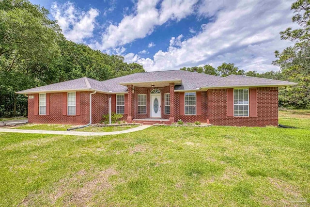 ranch-style house with brick siding and a front lawn