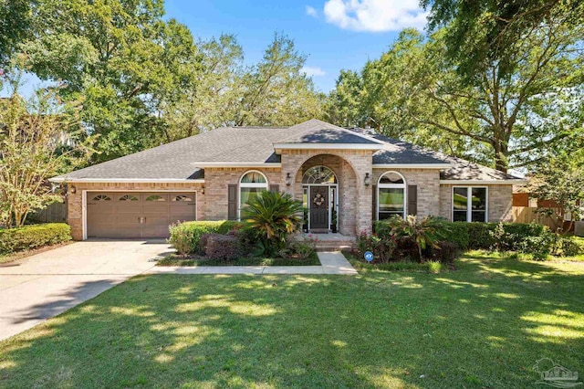 single story home featuring a garage and a front yard