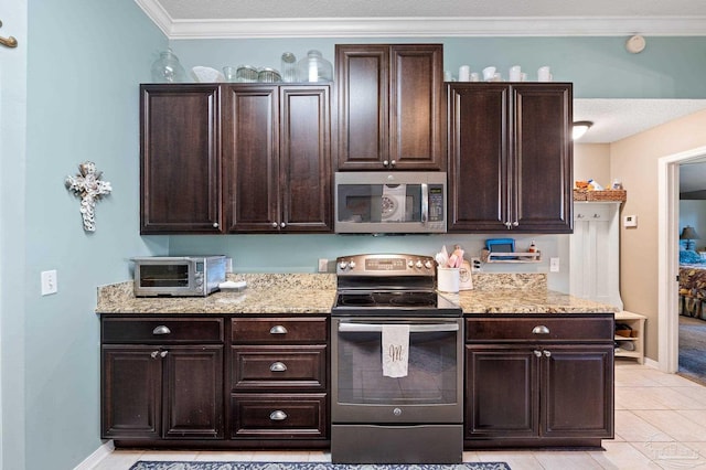 kitchen featuring stainless steel appliances, light tile patterned flooring, dark brown cabinetry, and crown molding