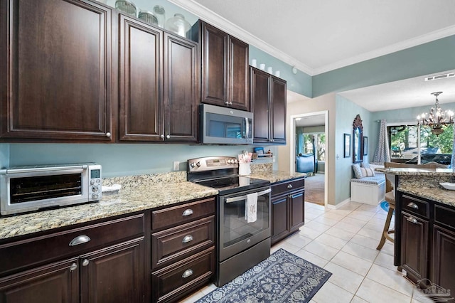 kitchen featuring pendant lighting, light tile patterned flooring, ornamental molding, a chandelier, and appliances with stainless steel finishes