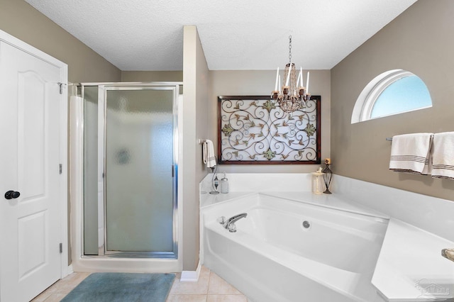 bathroom with separate shower and tub, a textured ceiling, and tile patterned floors