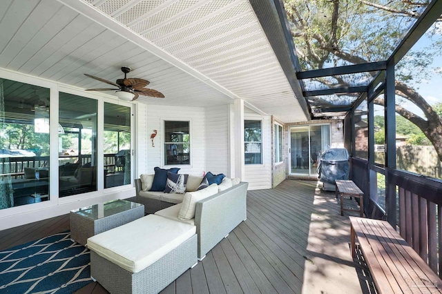 deck with ceiling fan and outdoor lounge area