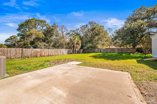 view of yard featuring a patio area and a fenced backyard