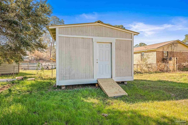 view of shed with fence