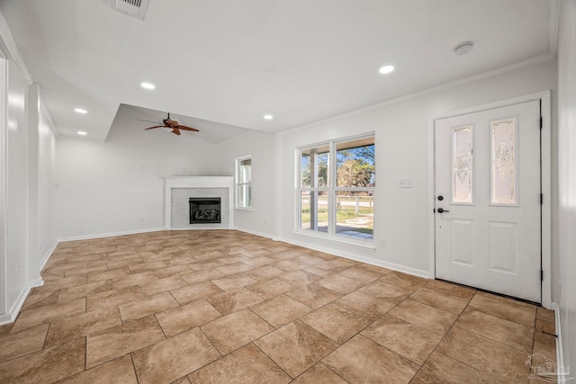 unfurnished living room with baseboards, visible vents, lofted ceiling, a fireplace, and recessed lighting