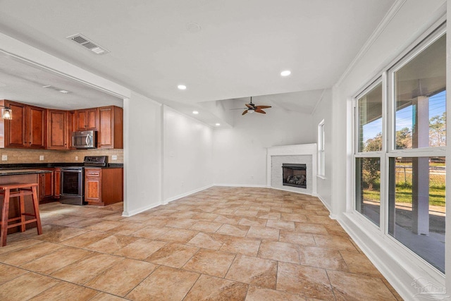 living room with visible vents, baseboards, ceiling fan, a fireplace, and recessed lighting