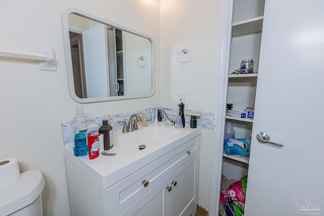 bathroom with vanity and toilet