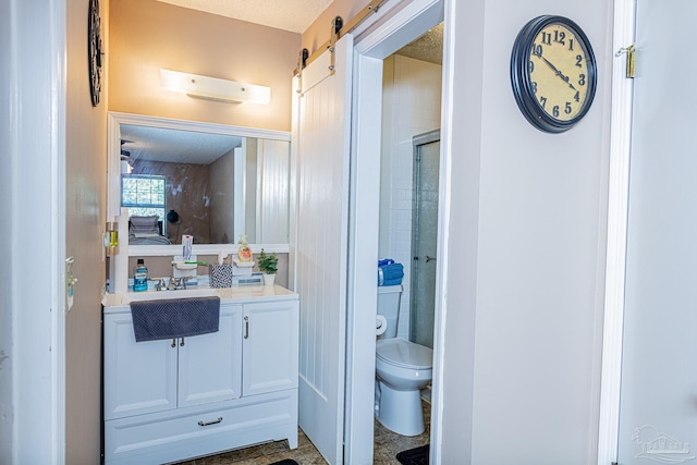 full bath featuring an enclosed shower, toilet, and vanity