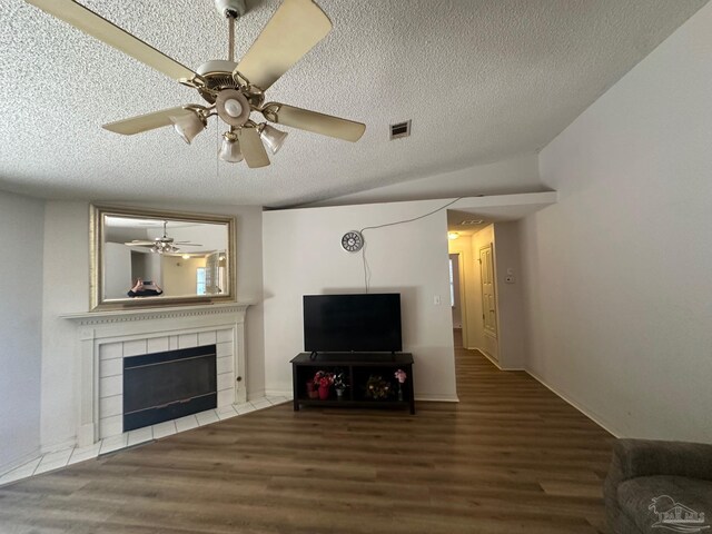 unfurnished room featuring dark hardwood / wood-style flooring, a textured ceiling, and ceiling fan