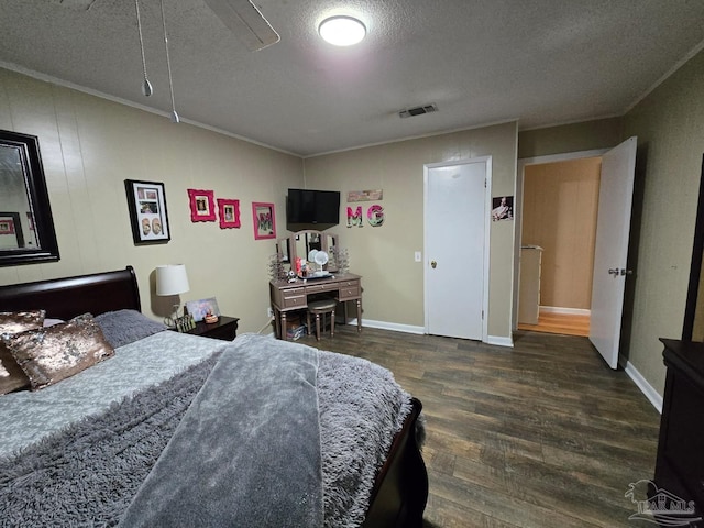 4940 Dawson Rd, Century, FL 32535 - bedroom with visible vents, a textured ceiling, crown molding, and wood finished floors