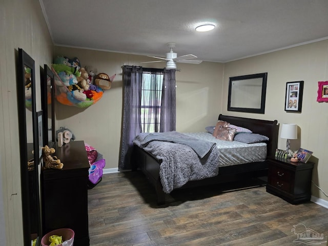 4940 Dawson Rd, Century, FL 32535 - bedroom with crown molding, baseboards, and wood finished floors