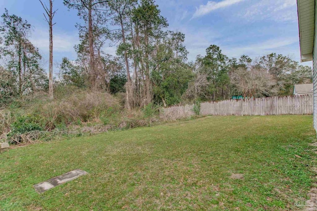 view of yard featuring fence