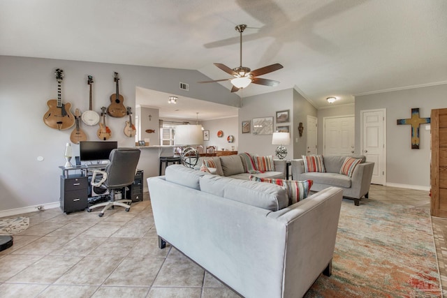 living area featuring crown molding, light tile patterned floors, a ceiling fan, vaulted ceiling, and baseboards