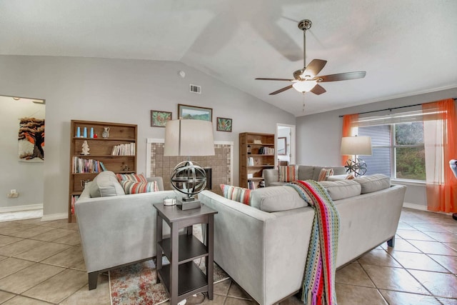 living room with light tile patterned floors, ceiling fan, lofted ceiling, baseboards, and a brick fireplace