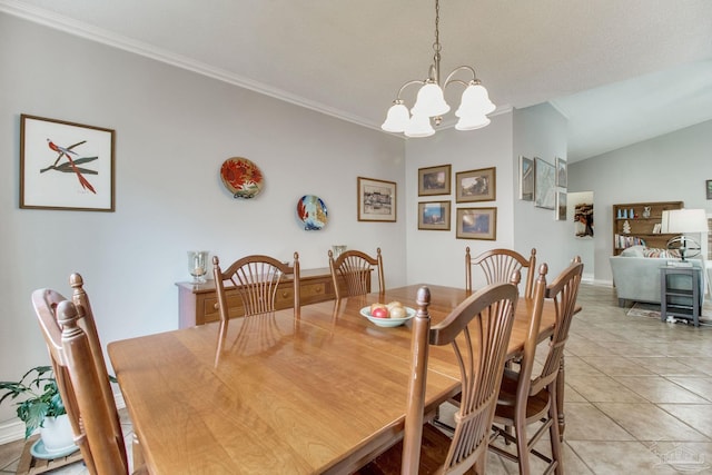 dining space featuring a chandelier, vaulted ceiling, ornamental molding, and light tile patterned floors