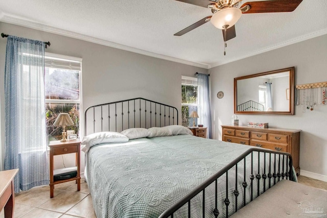 bedroom with ornamental molding, light tile patterned flooring, and a textured ceiling