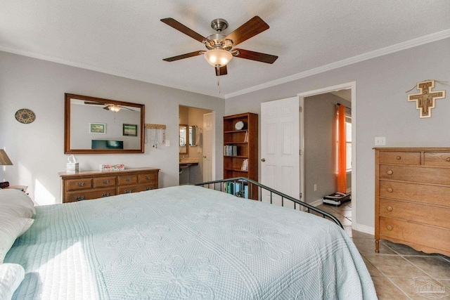 bedroom with ceiling fan, ornamental molding, tile patterned flooring, and connected bathroom