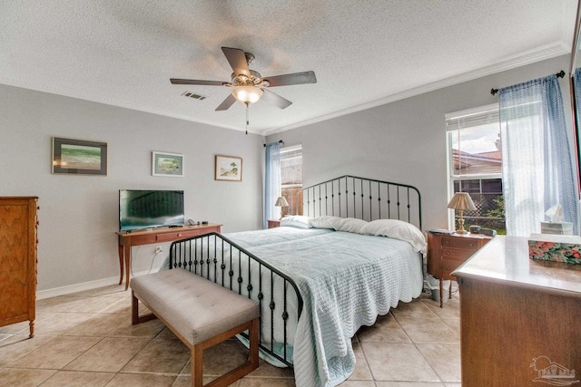 bedroom with light tile patterned flooring, visible vents, crown molding, and multiple windows