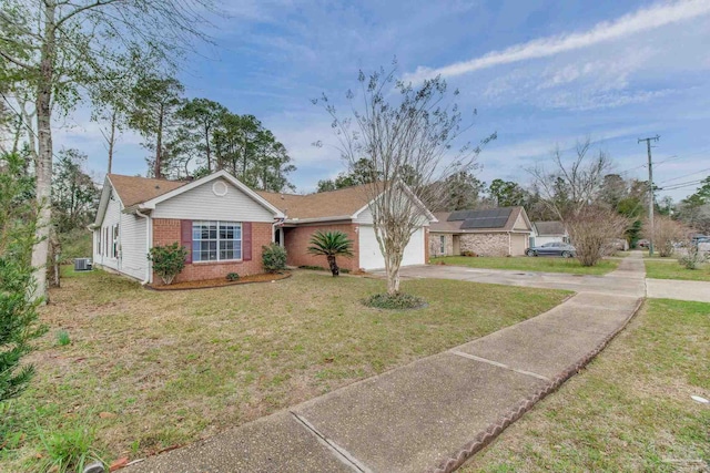 ranch-style home featuring brick siding, concrete driveway, central AC, a garage, and a front lawn