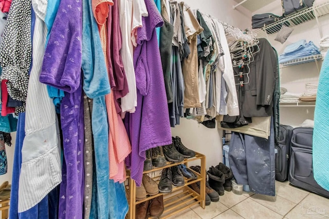 spacious closet with tile patterned floors