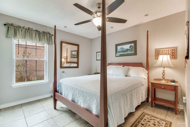 bedroom with baseboards, a ceiling fan, and light tile patterned flooring