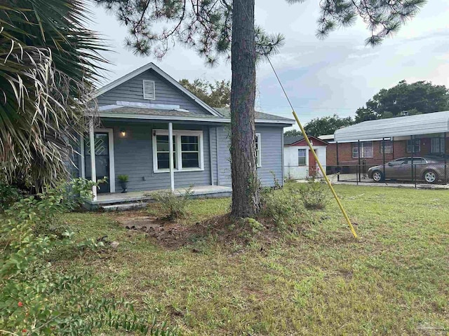 exterior space with a porch and a front lawn