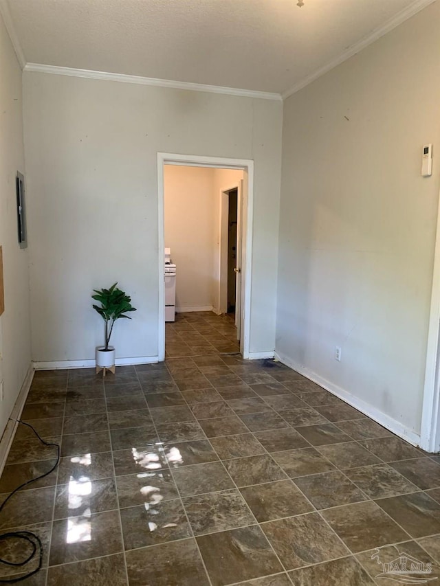 spare room featuring crown molding