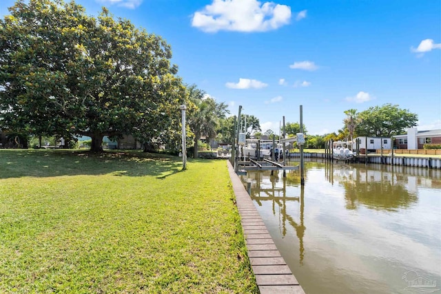 3332 Laurel Dr, Gulf Breeze, FL 32563 - dock featuring a lawn, a water view, and boat lift