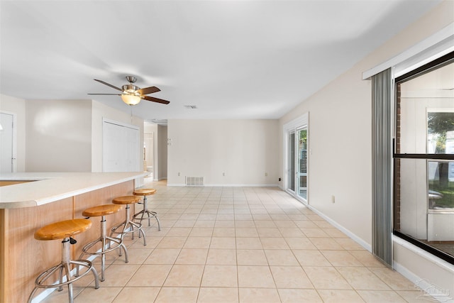 3332 Laurel Dr, Gulf Breeze, FL 32563 - empty room featuring light tile patterned floors, ceiling fan, healthy amount of natural light, and baseboards
