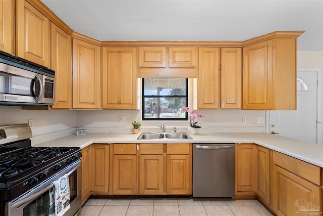 3332 Laurel Dr, Gulf Breeze, FL 32563 - kitchen featuring stainless steel appliances, a sink, light countertops, and light tile patterned flooring