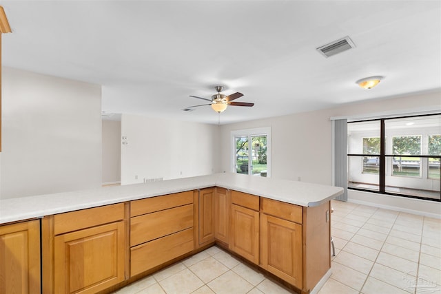 3332 Laurel Dr, Gulf Breeze, FL 32563 - kitchen with ceiling fan, light countertops, and light tile patterned flooring