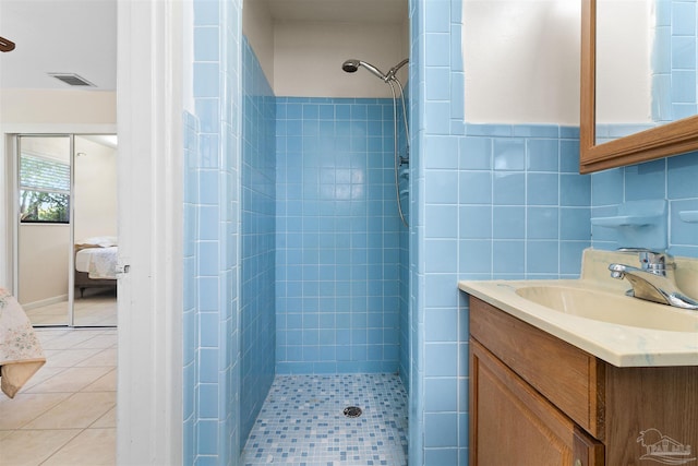 3332 Laurel Dr, Gulf Breeze, FL 32563 - ensuite bathroom featuring a tile shower, vanity, and tile patterned floors
