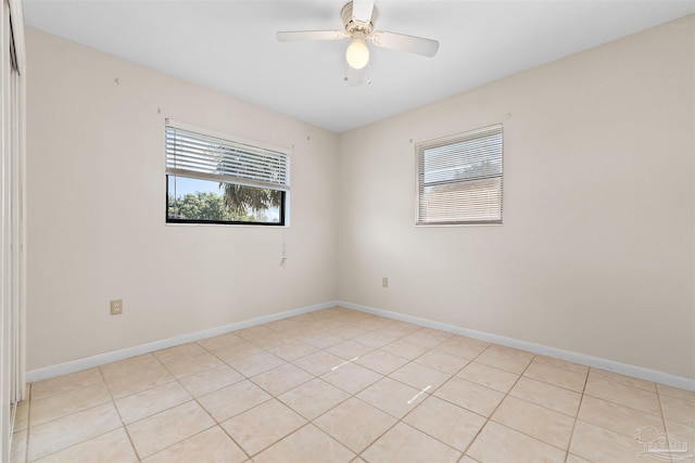 3332 Laurel Dr, Gulf Breeze, FL 32563 - spare room with light tile patterned flooring, ceiling fan, and baseboards