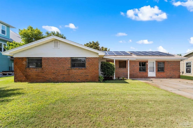 3332 Laurel Dr, Gulf Breeze, FL 32563 - back of property with solar panels, brick siding, and a lawn