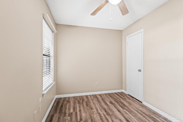 empty room with ceiling fan, a textured ceiling, and hardwood / wood-style flooring